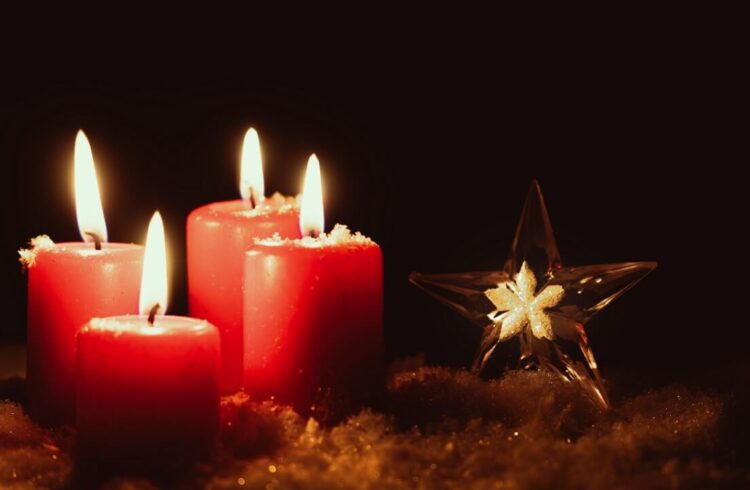 Red candles alongside a star