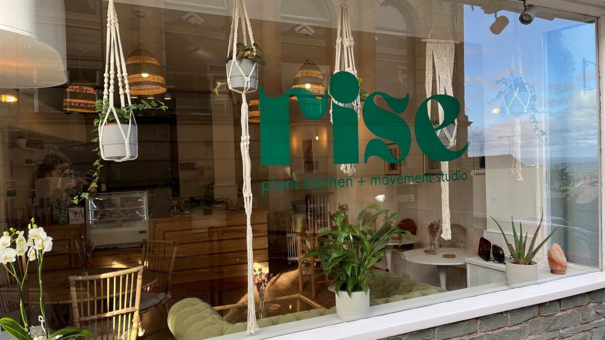 Exterior view of Rise with branding in window