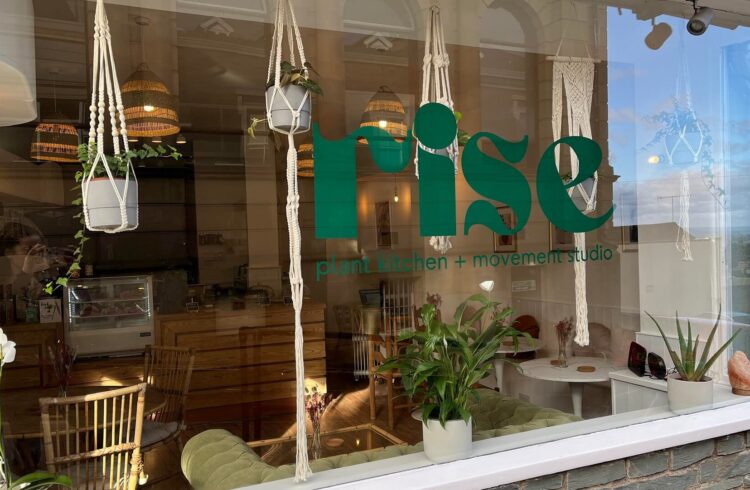 Exterior view of Rise with branding in window