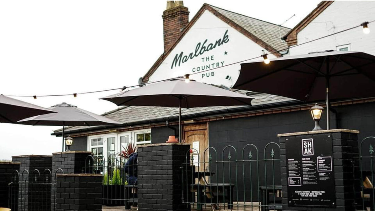Exterior of the pub and outdoor seating