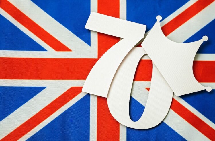 The Union Flag overlaid with a 70 wearing a crown