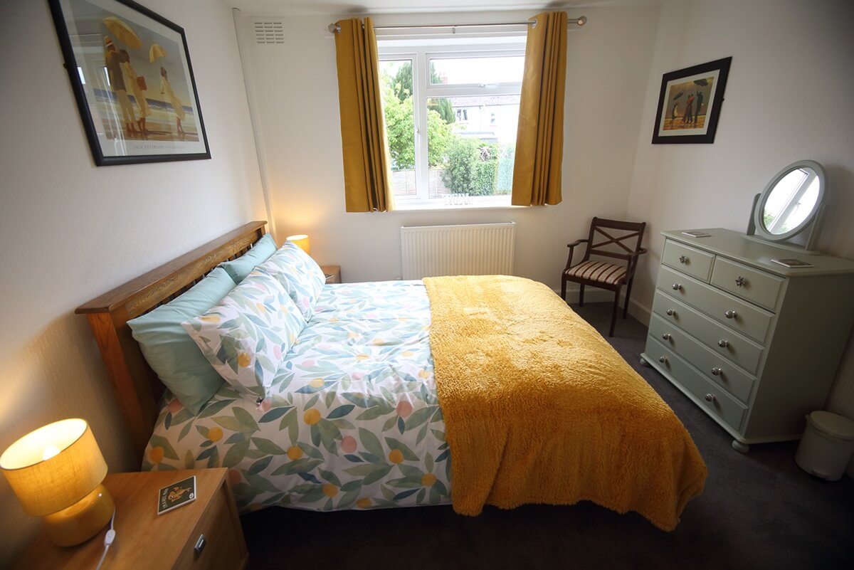 Bedroom with chest of drawers, chair etc.