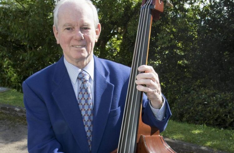 Len Thwaites poses with a double bass