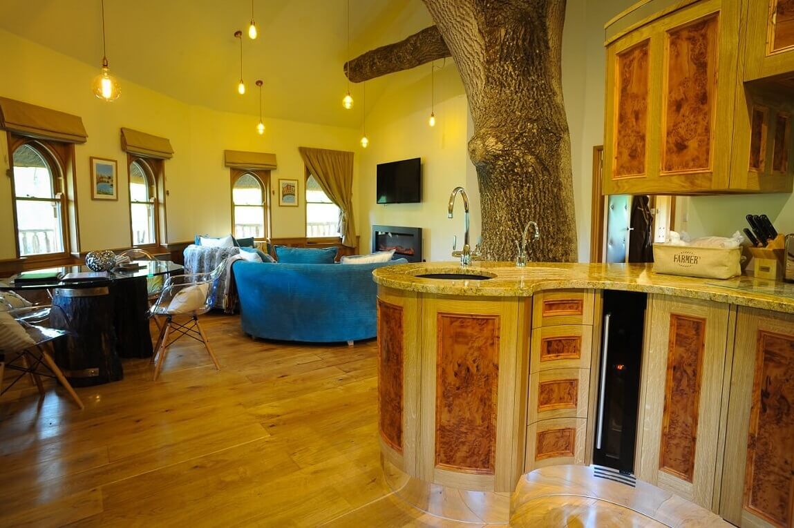 Inside Treeopia treehouse - kitchen, seating and dining area