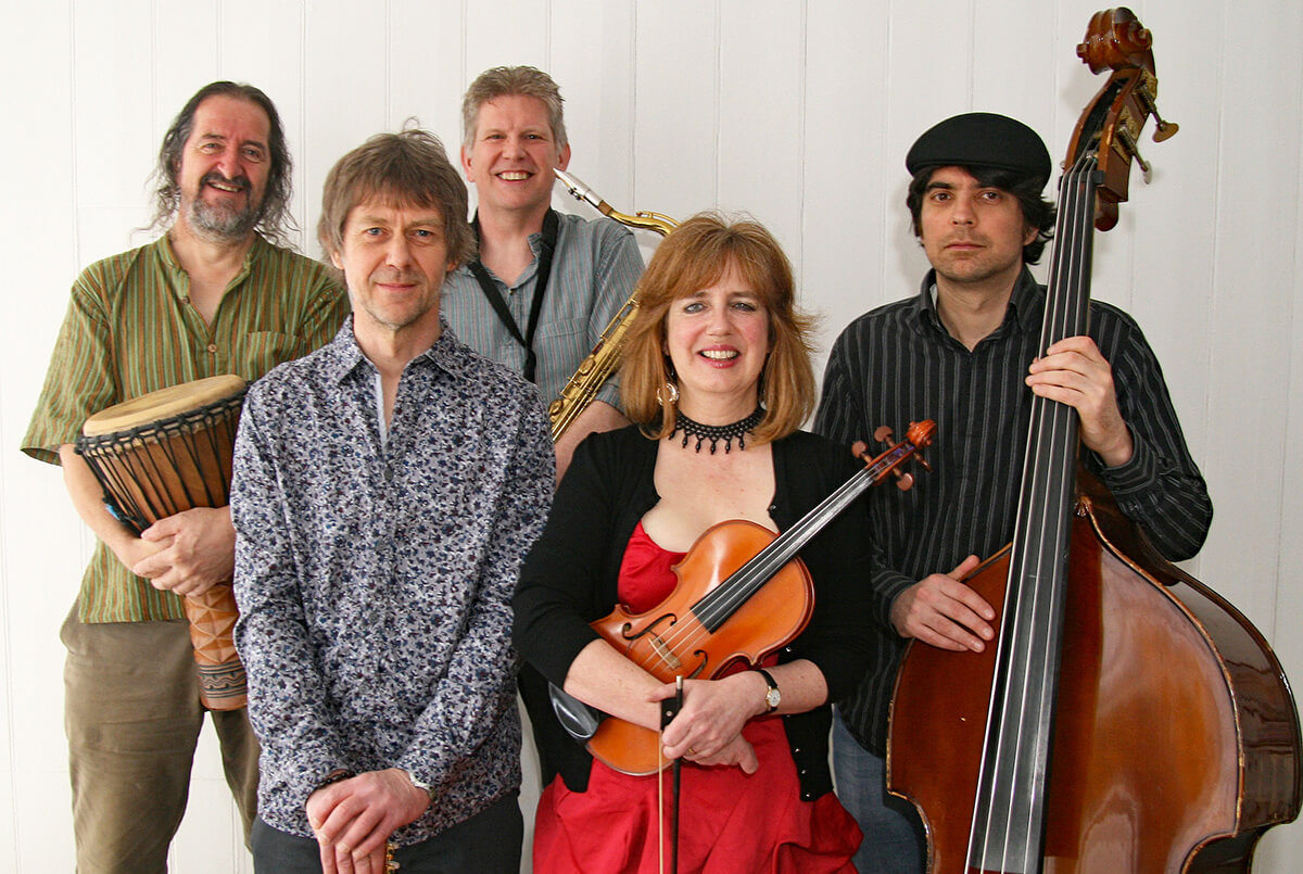 Members of Flatword, 4 men and 1 woman and their instruments