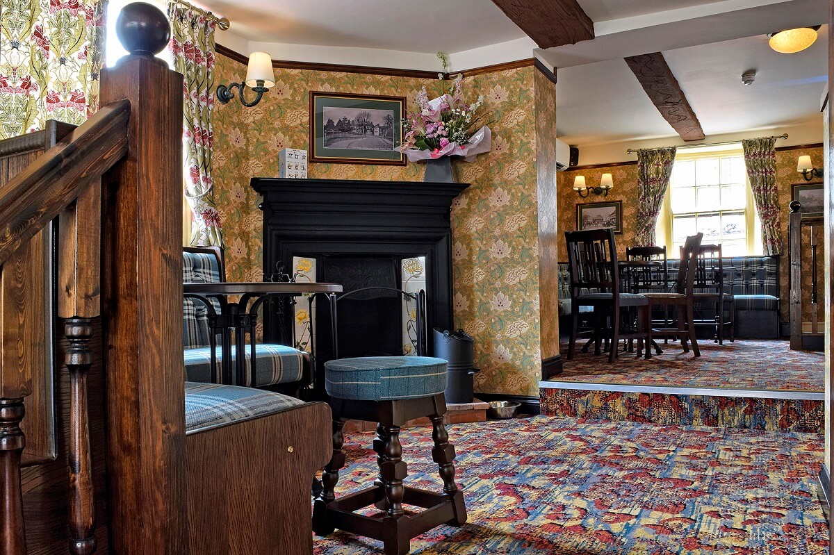 Pub interior - tables and chairs, fireplace