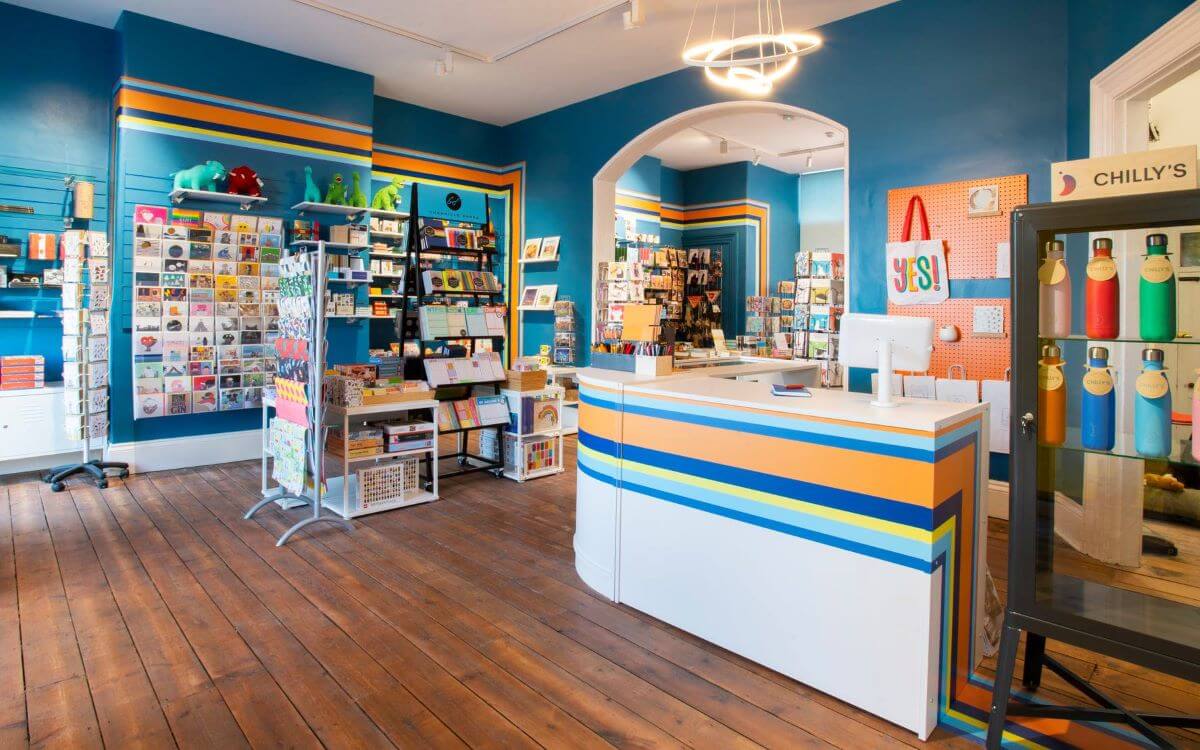 Card shop interior with colourful orange yellow and blue interior
