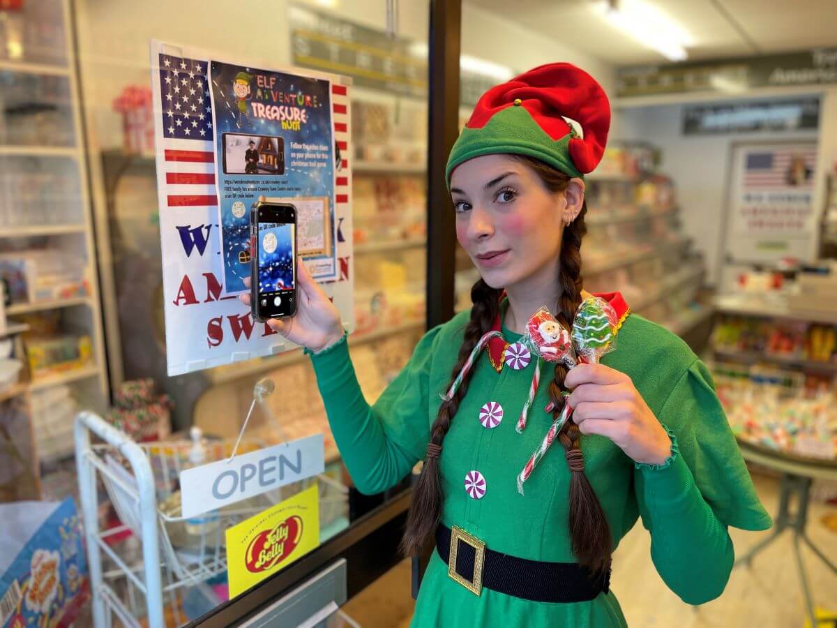 An elf interacting with a QR code