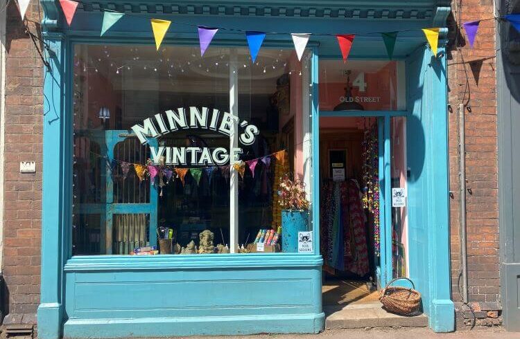 Turquoise blue shop front with bunting