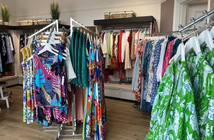 Clothing shop interior with colourful women's clothing
