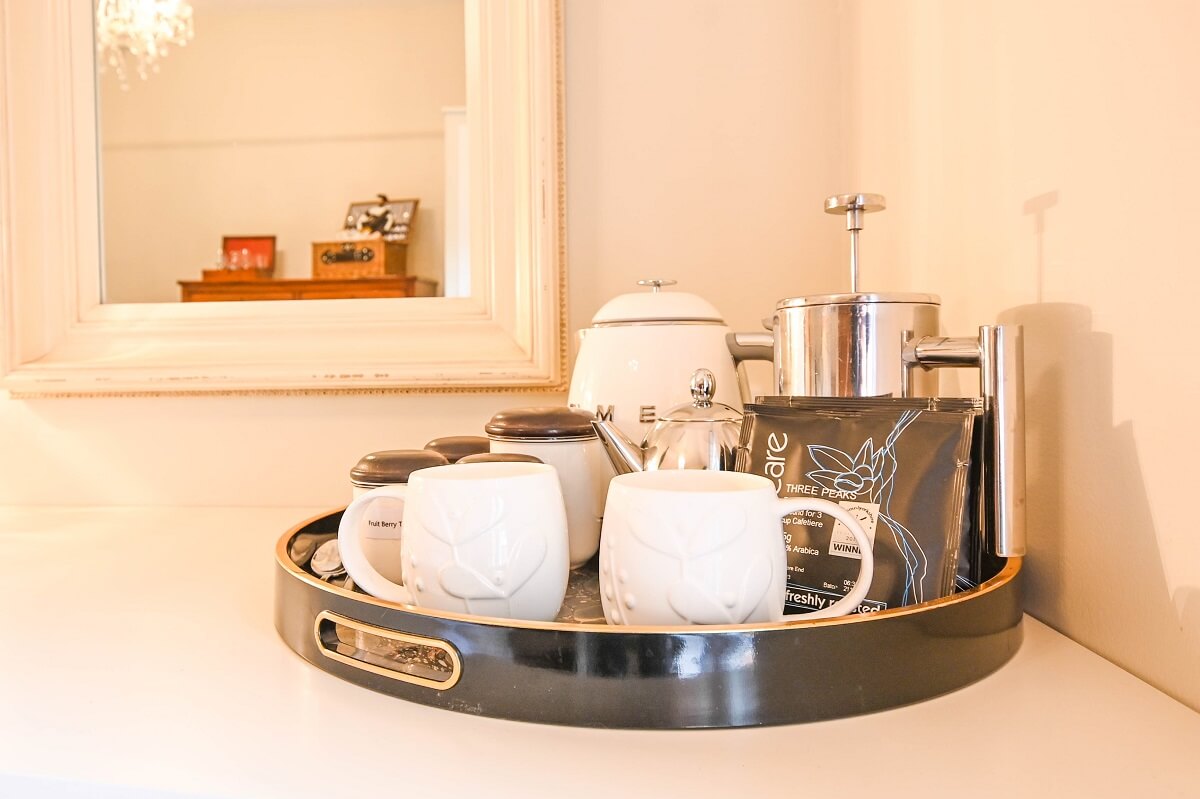 Tray with cafetiere, teapot, mugs, coffee and tea