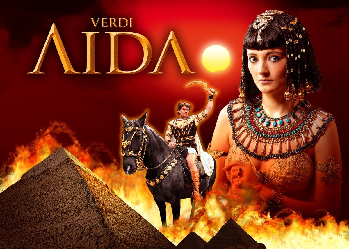 Aida behind the pyramids with an orange glowing sun