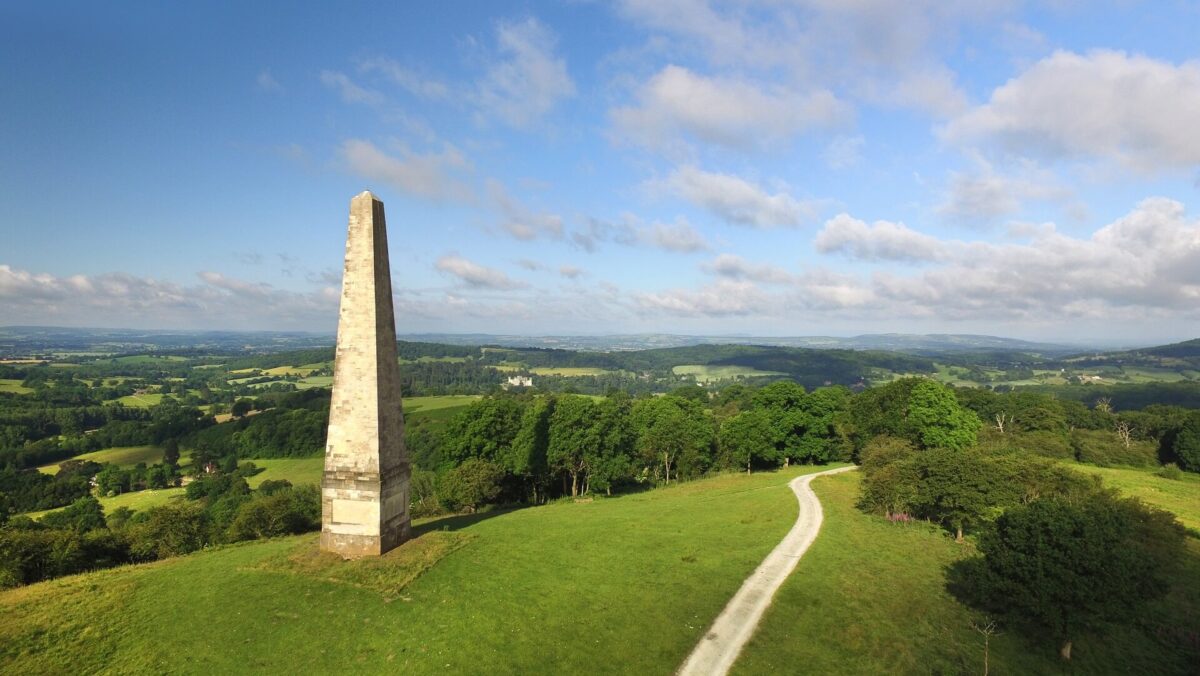 Obelisk and Eastnor Deer Park with view stretching into Herefordshire countryside