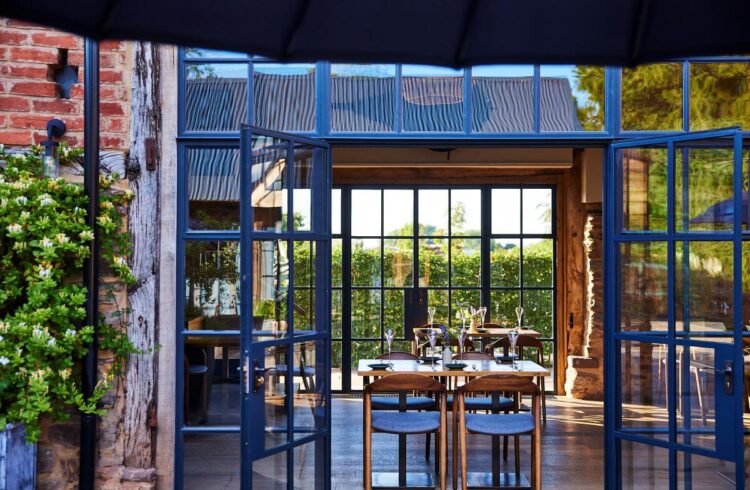 Barn style restaurant with open Crittall windows