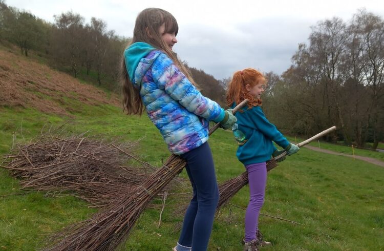 Two children at the birch broom making workshop