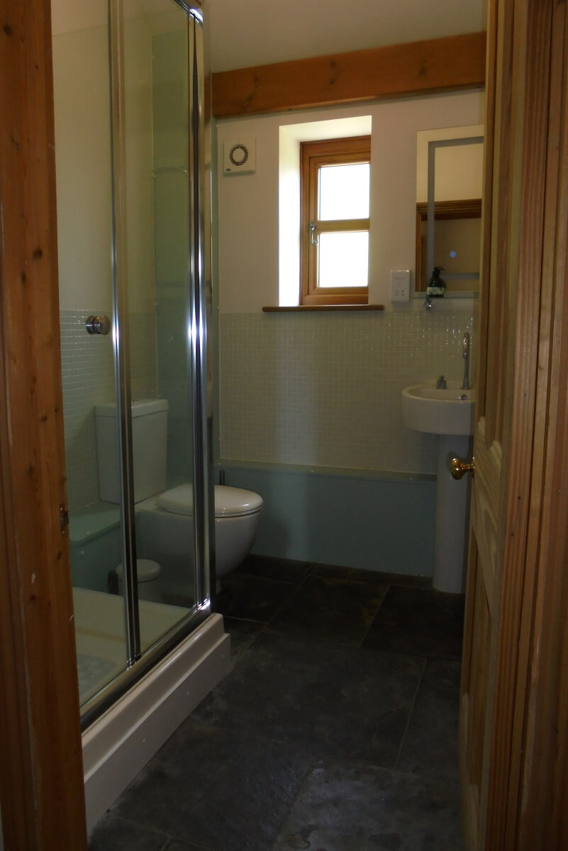 Bathroom with shower, WC and sink