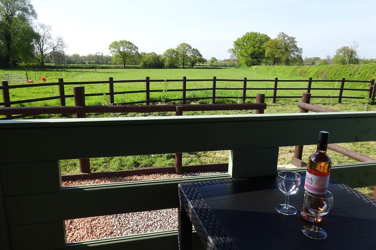 Outdoor seating area with view over fields