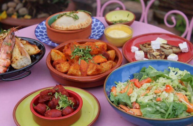 Spanish tapas on colourful plates