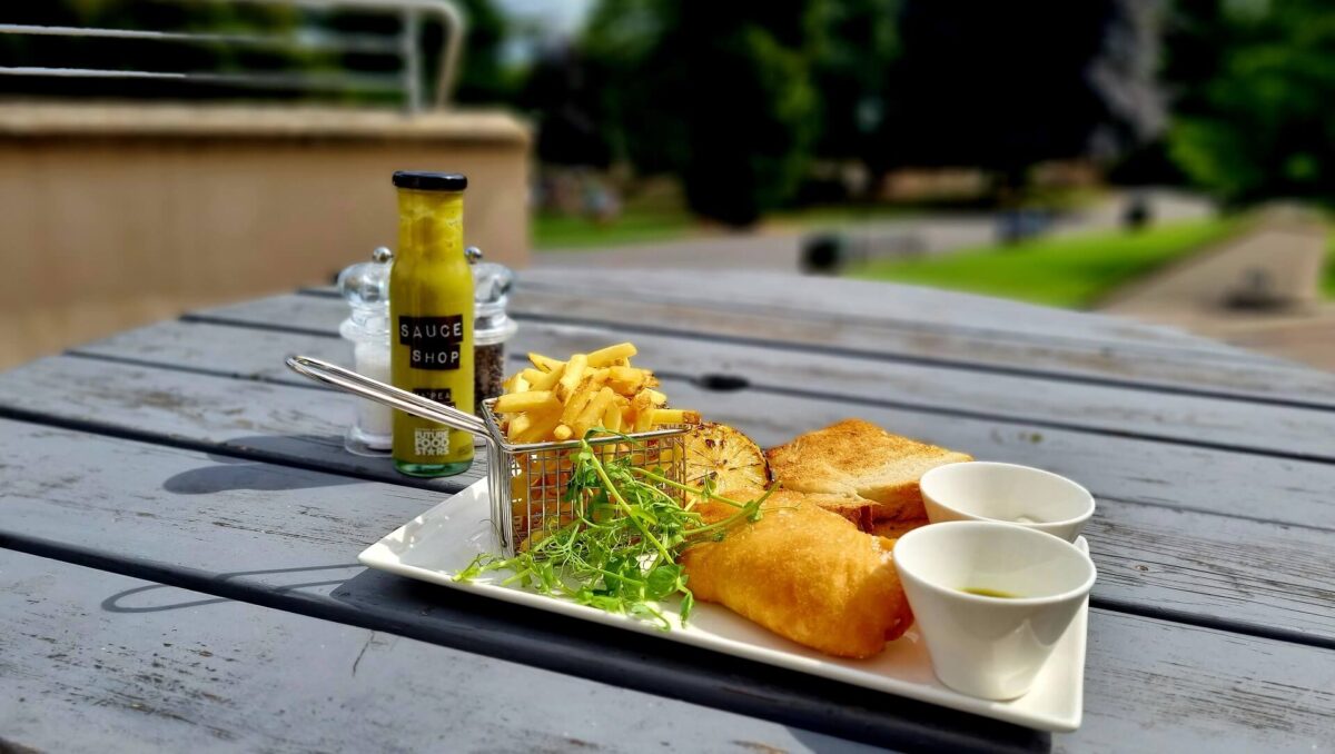 Fish and chips served on an outside table