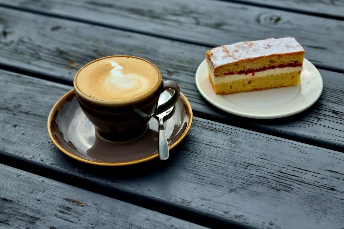 Coffee and cake served on an outside table