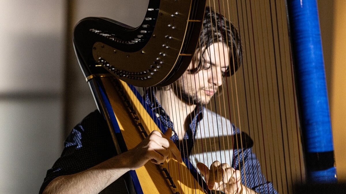 Ben Creighton-Griffiths playing the harp