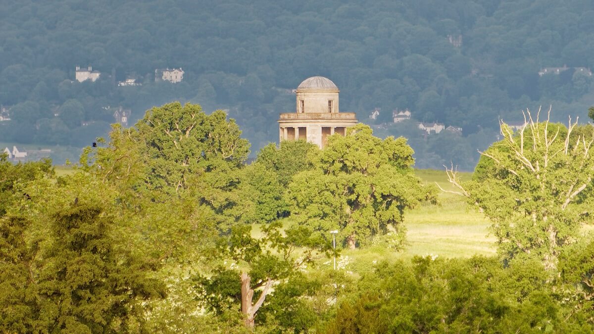 View of the Panorama Tower at Croome with trees in foreground