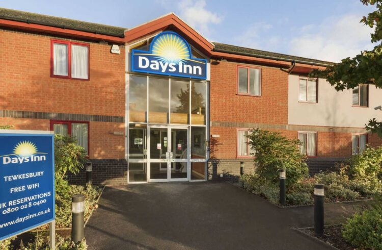 Exterior of Days Inn showing glass doors at entrance