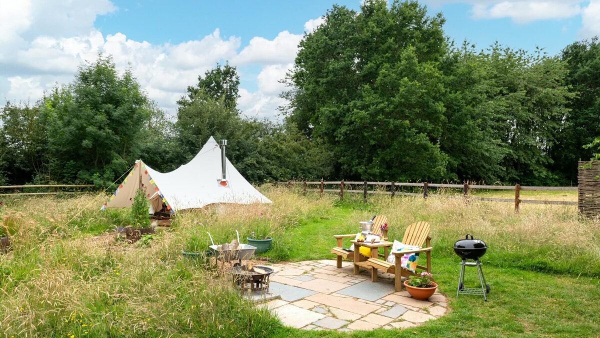 Exterior of bell tent and outdoor seating area
