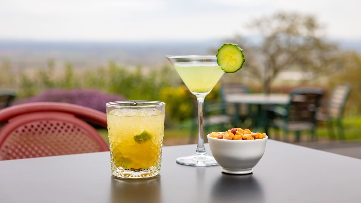 Drinks and snacks on an outdoor table with views over the Severn Plain