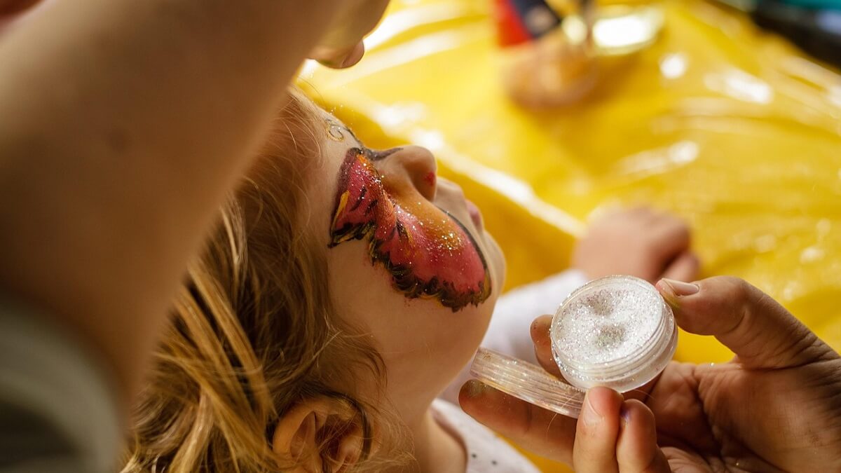 A child who has had their face painted